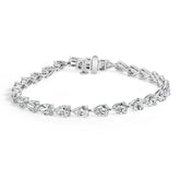 Silver bracelet with clear gemstones on a white background