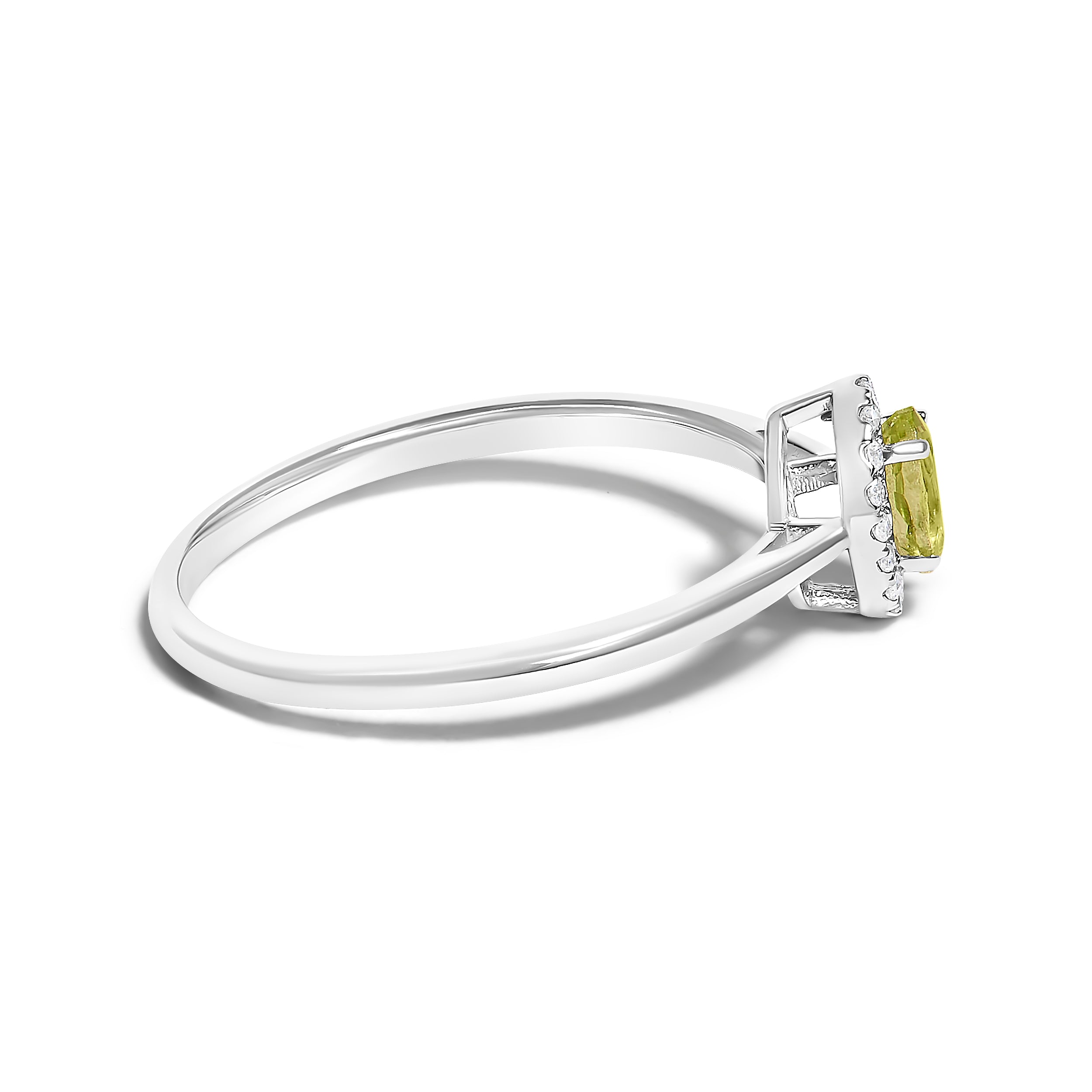 Silver ring with a green gemstone on a white background