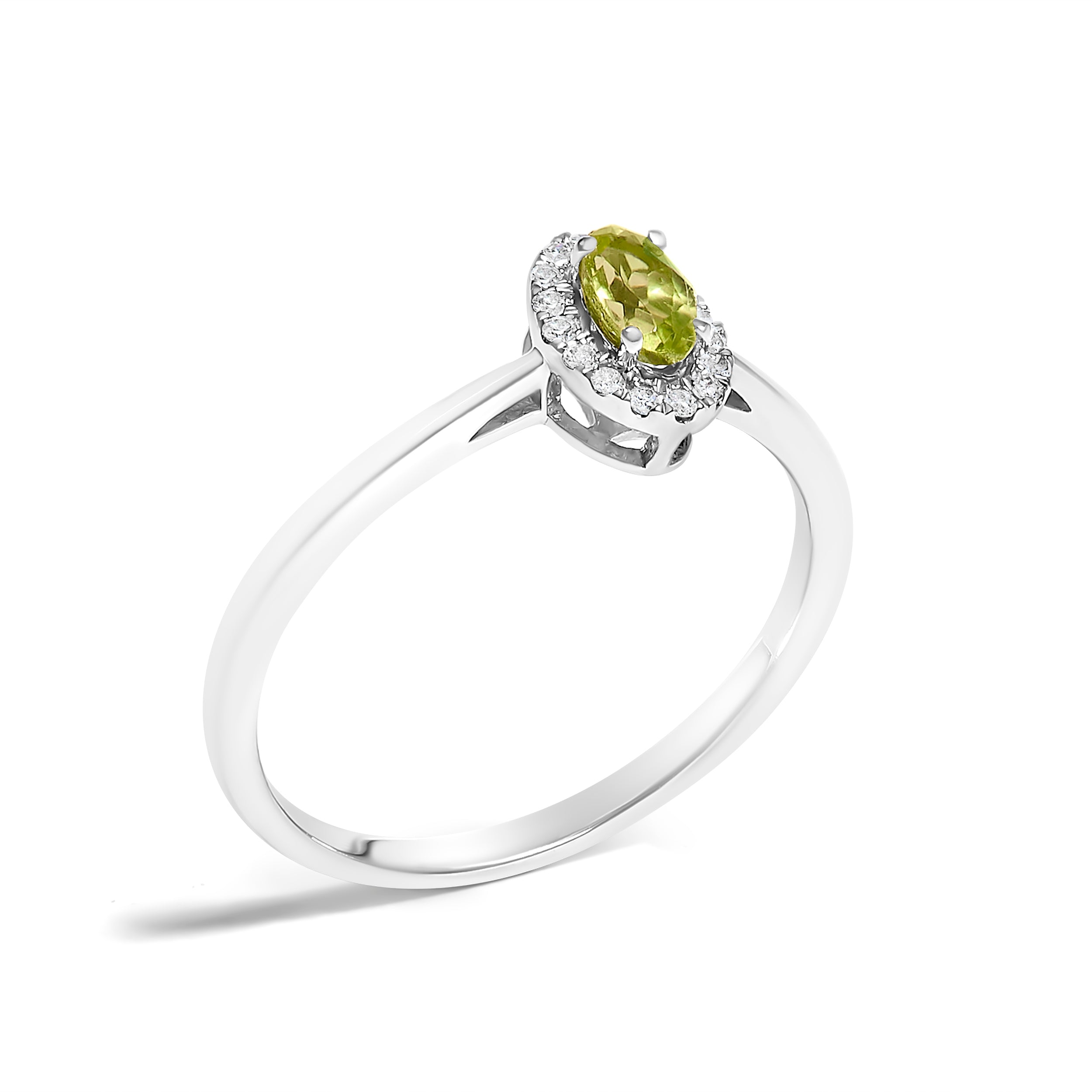 Silver ring with a green gemstone on a white background
