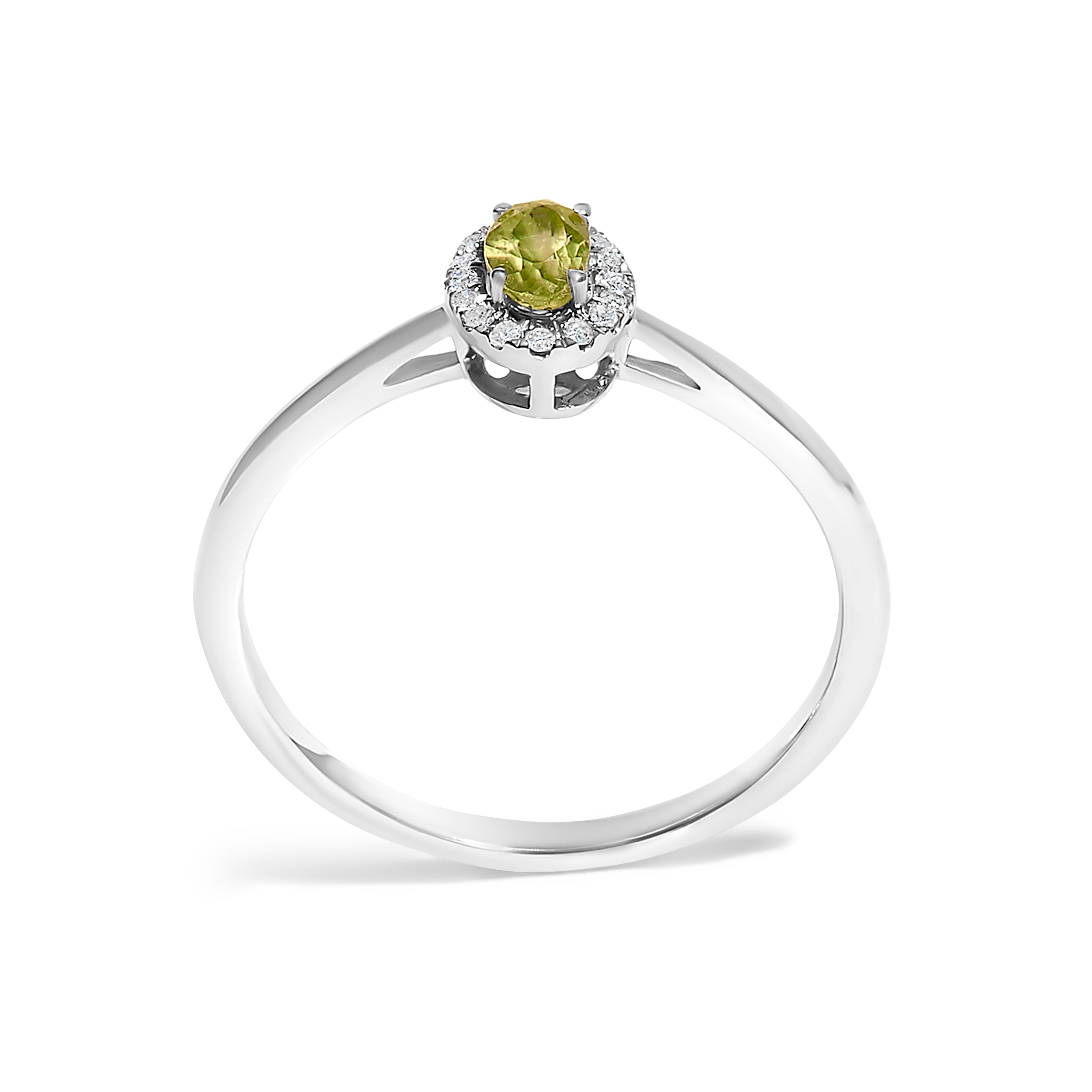 Silver ring with a green gemstone on a white background