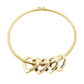 Gold necklace with interlocking heart pendants engraved with names on a white background