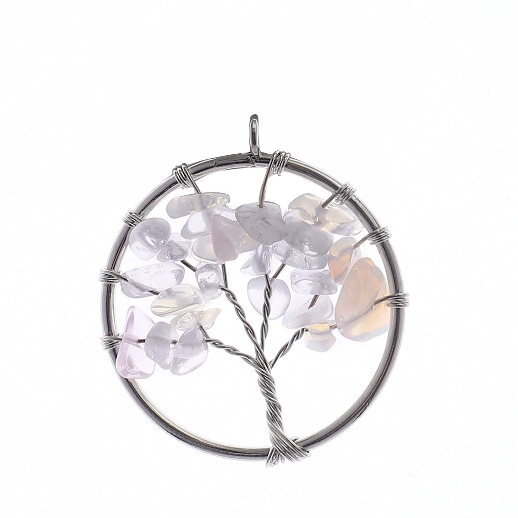 Tree-shaped pendant with multicolored stones on a white background