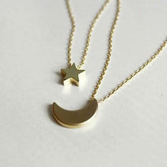 Golden Moon and Star Charms on a Layered Chain Necklace