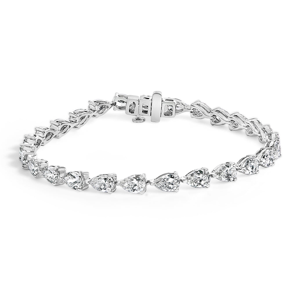 Silver bracelet with clear gemstones on a white background
