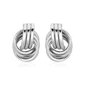 Pair of silver knot earrings on a white background