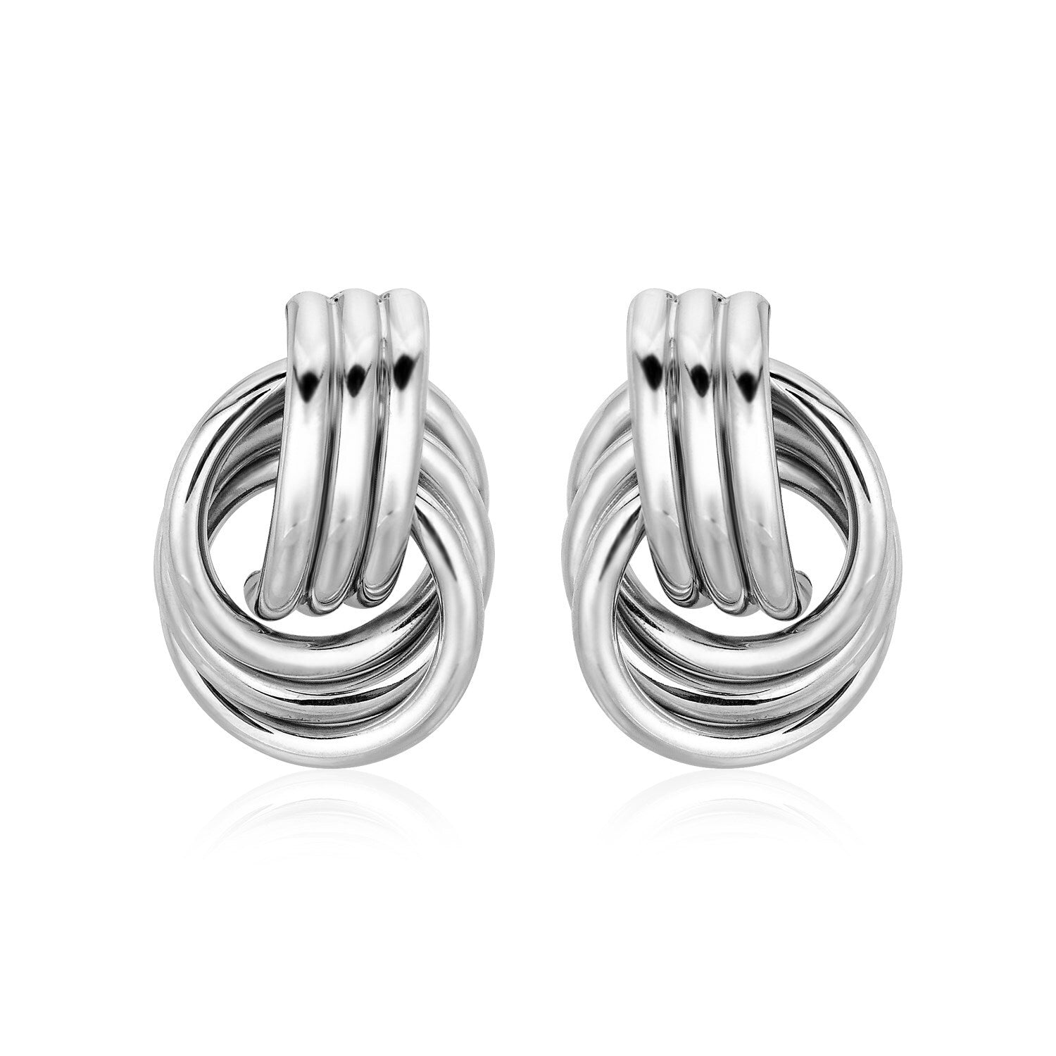 Pair of silver knot earrings on a white background