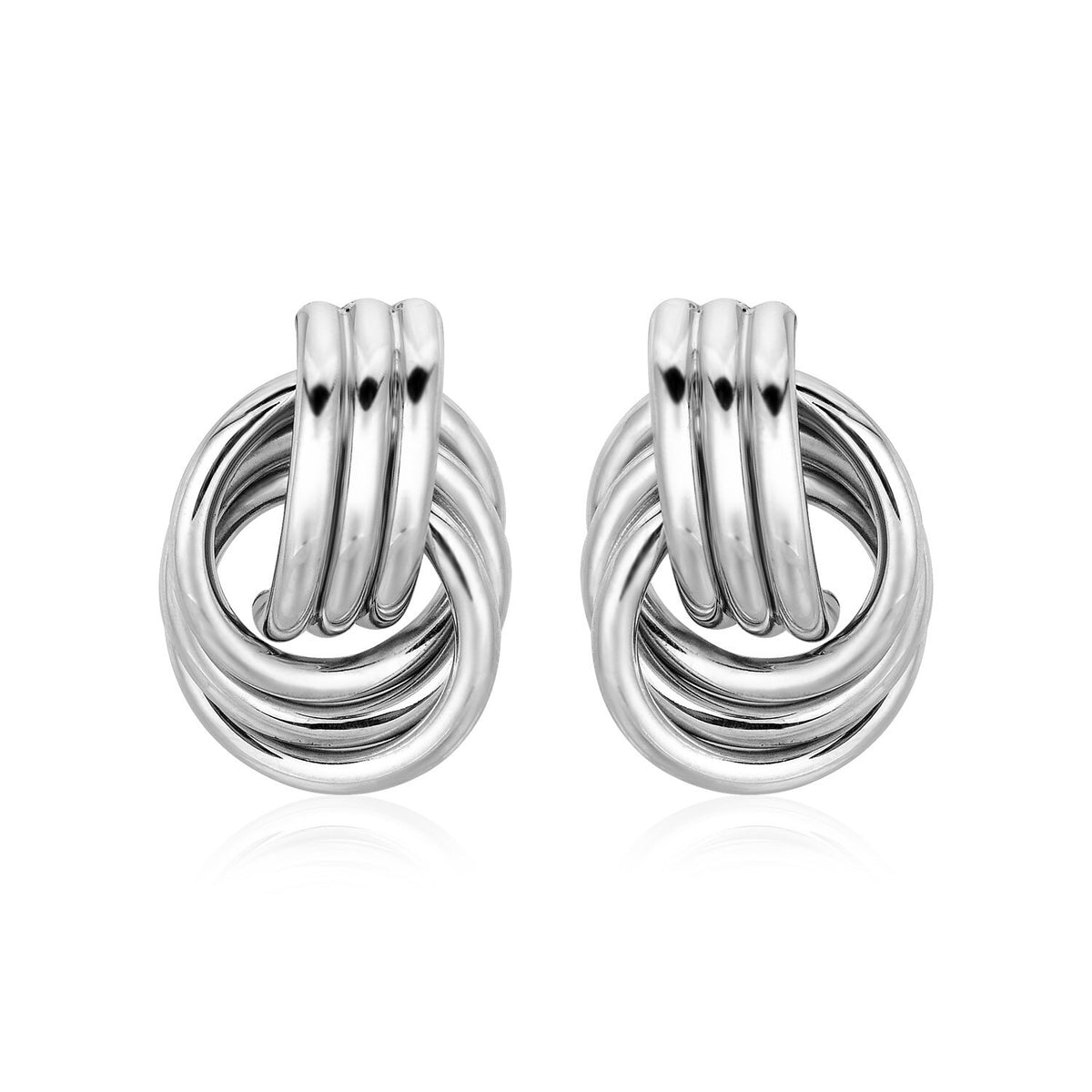 Pair of silver knot earrings on a white background