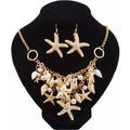 Jewelry set with necklace and earrings on a black stand