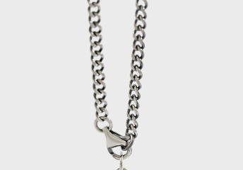 Silver chain necklace on a white background