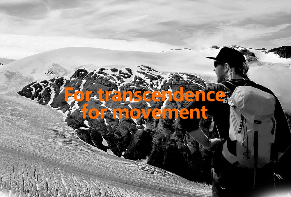 Person with a backpack looking at snowy mountains with text 'For transcendence for movement'.