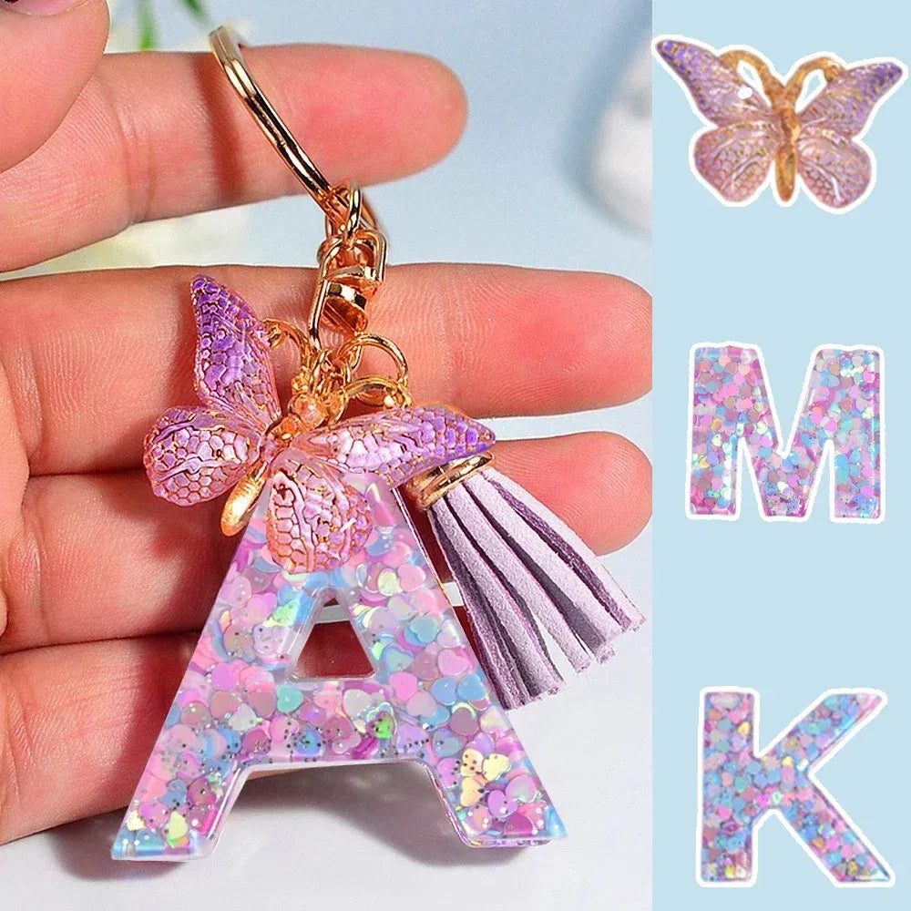 Color: Dark Brown - Fashion Tassel Butterfly 26Letter Keychain Colorful Love Heart Filled Resin Alphabet Keyring Women Girls Car Bag Phone Pendant