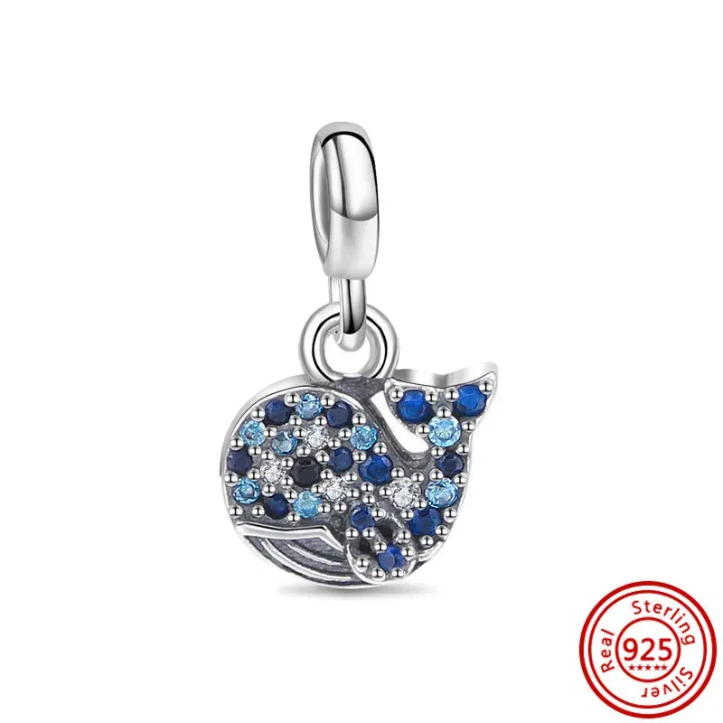 Silver charm with blue and white stones on a white background, featuring a 'Sterling 925' stamp.