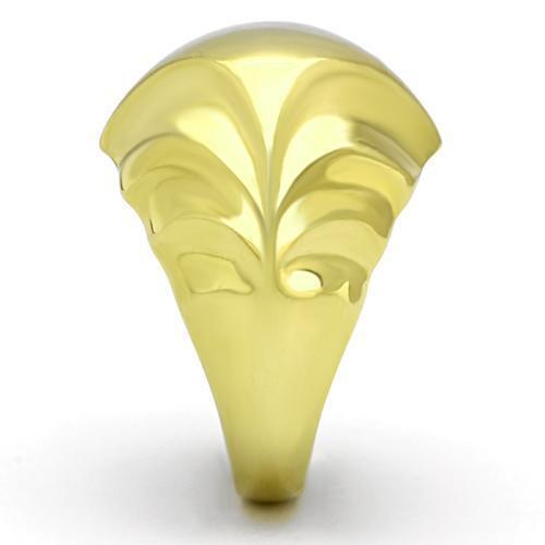 Gold-colored ring with decorative design on a white background